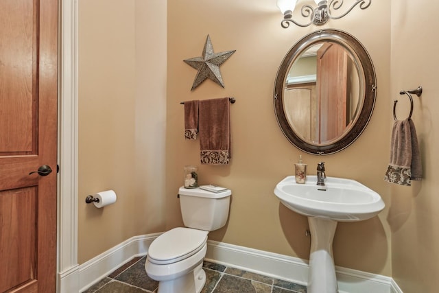 831 Alberosky Way, Batavia, IL 60510 - bathroom with baseboards, toilet, and stone tile floors