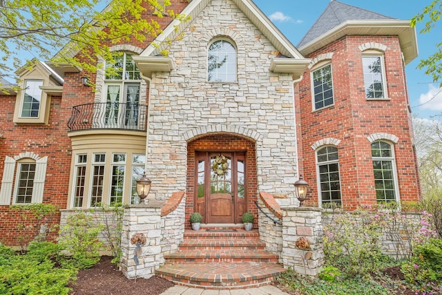 831 Alberosky Way, Batavia, IL 60510 - french country style house featuring a balcony, stone siding, brick siding, and entry steps