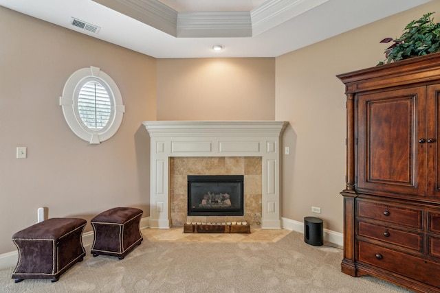 831 Alberosky Way, Batavia, IL 60510 - living area with light carpet, crown molding, a tiled fireplace, a raised ceiling, and baseboards
