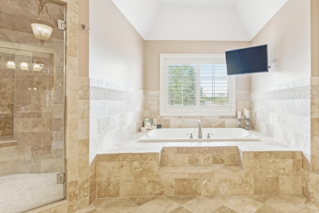 831 Alberosky Way, Batavia, IL 60510 - full bathroom featuring a garden tub, tile walls, a shower stall, lofted ceiling, and a wainscoted wall