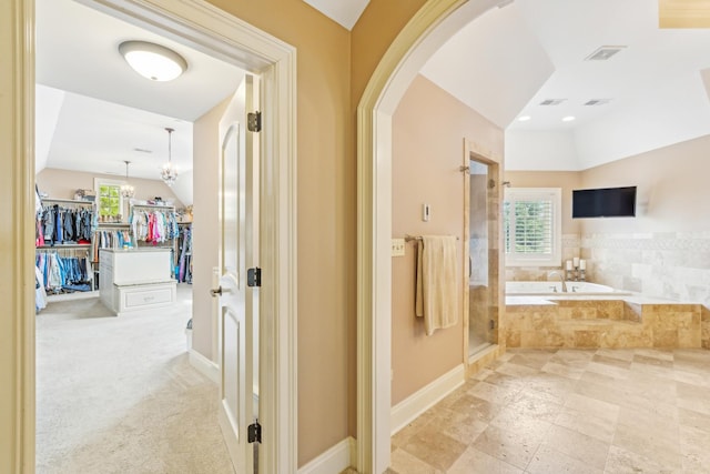 831 Alberosky Way, Batavia, IL 60510 - bathroom with vaulted ceiling, a shower stall, a bath, baseboards, and a walk in closet