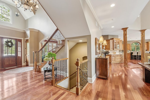 831 Alberosky Way, Batavia, IL 60510 - foyer with healthy amount of natural light, light wood-style floors, a high ceiling, a chandelier, and recessed lighting