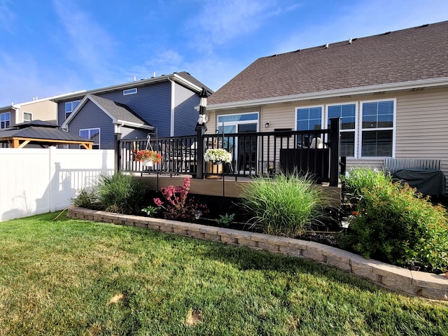 1027 Blazing Star St, South Elgin, IL 60177 - rear view of house featuring a lawn, a deck, and fence
