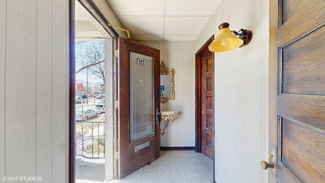 4734 W Palmer St, Chicago, IL 60639 - hall featuring a paneled ceiling, baseboards, and light floors