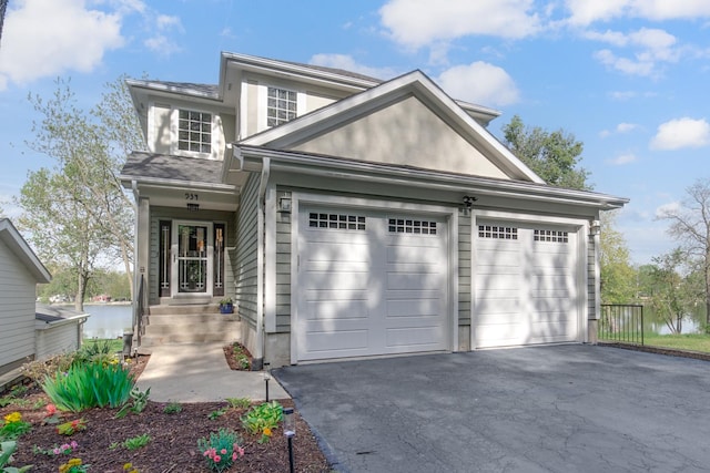 934 Robertson Rd, South Elgin, IL 60177 - traditional-style house featuring asphalt driveway and an attached garage
