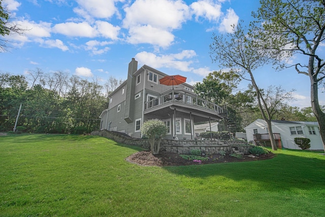 934 Robertson Rd, South Elgin, IL 60177 - back of property featuring a yard, a chimney, and a balcony