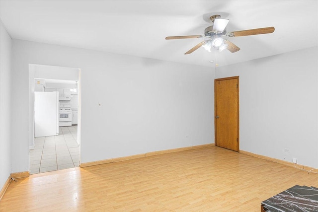 5817 W 16th St, Cicero, IL 60804 - unfurnished room featuring baseboards, wood finished floors, and a ceiling fan