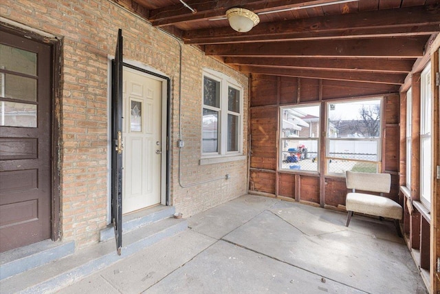 5817 W 16th St, Cicero, IL 60804 - unfurnished sunroom featuring beamed ceiling