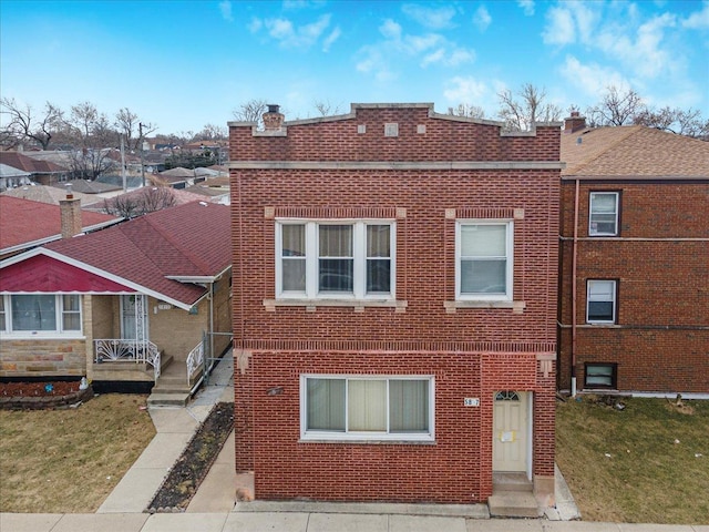 5817 W 16th St, Cicero, IL 60804 - view of front facade with a chimney, brick siding, and a front lawn