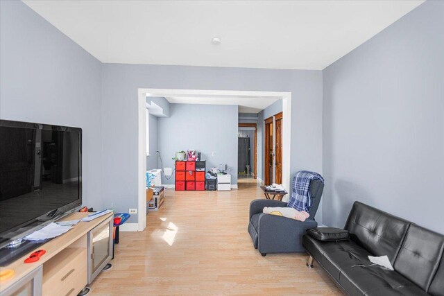 5817 W 16th St, Cicero, IL 60804 - living area with baseboards and light wood-style floors