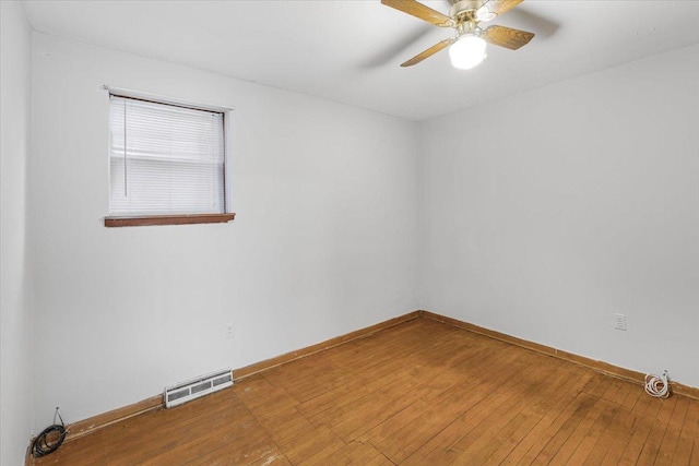 5817 W 16th St, Cicero, IL 60804 - spare room featuring hardwood / wood-style floors, baseboards, visible vents, and a ceiling fan