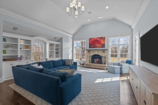 living room featuring crown molding, a chandelier, a fireplace, dark wood-style floors, and lofted ceiling