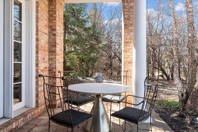 view of patio featuring outdoor dining area