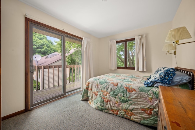 bedroom with baseboards, multiple windows, carpet flooring, and access to outside