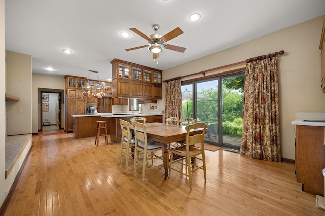 dining room with recessed lighting, light wood-style flooring, baseboards, and a ceiling fan