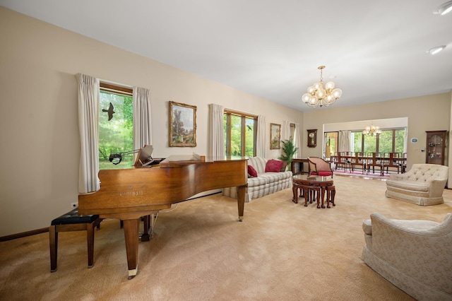 living area with a chandelier, light carpet, and a wealth of natural light