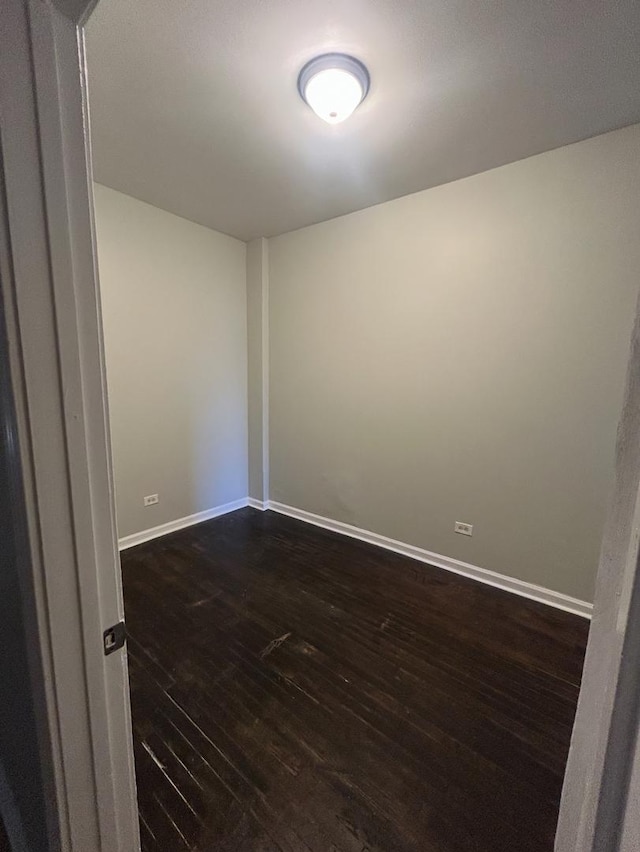5121 S Loomis Blvd, Chicago, IL 60609 - spare room with dark wood-type flooring and baseboards