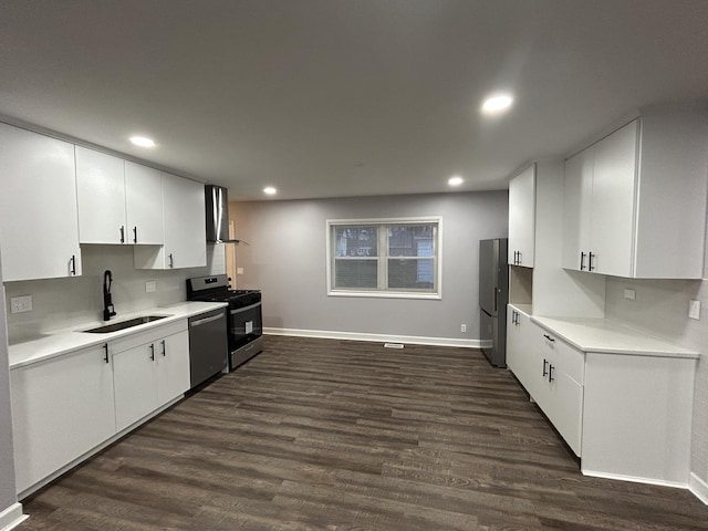 kitchen with a sink, dark wood finished floors, baseboards, and stainless steel appliances