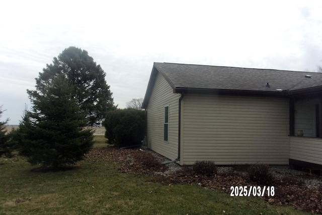 507 N Fifth St, Ashkum, IL 60911 - view of property exterior featuring a lawn and roof with shingles