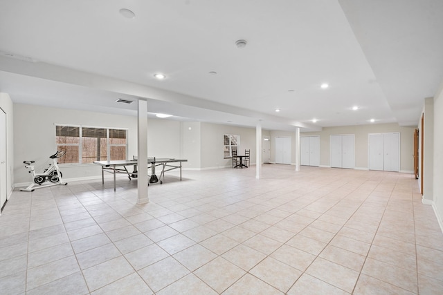 below grade area featuring light tile patterned floors, baseboards, recessed lighting, and visible vents