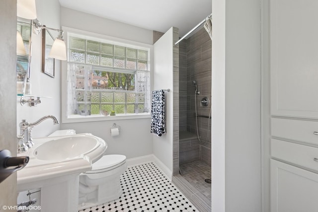 807 Webster Ave, Wheaton, IL 60187 - full bathroom with a stall shower, a sink, baseboards, tile patterned floors, and toilet