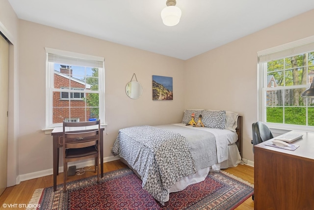 807 Webster Ave, Wheaton, IL 60187 - bedroom with baseboards, a closet, and wood finished floors