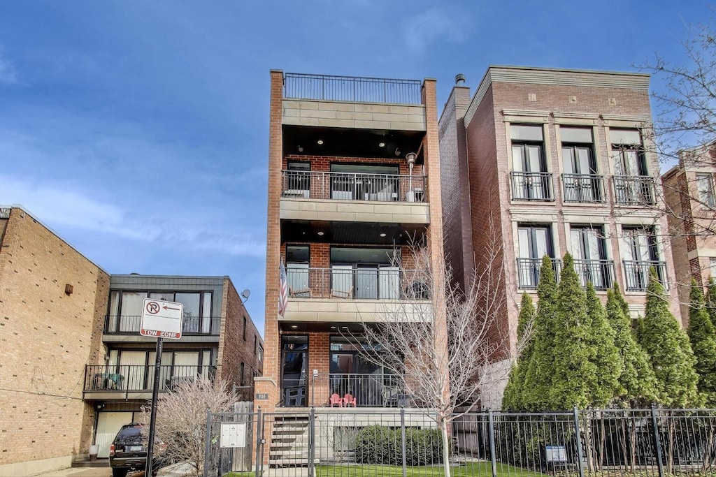 view of building exterior featuring fence