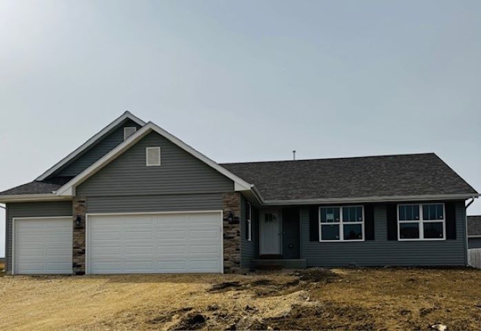 1110 Burlington Way, Davis Junction, IL 61020 - single story home with stone siding, driveway, and an attached garage