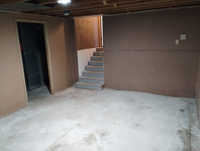 unfinished basement with stairway