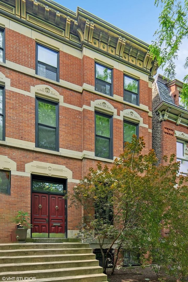 1957 W Schiller St, Chicago, IL 60622 - doorway to property featuring brick siding
