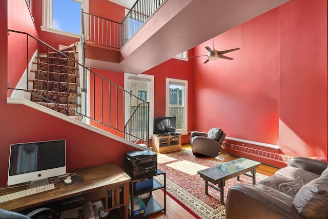 1957 W Schiller St, Chicago, IL 60622 - living area featuring a high ceiling, wood finished floors, a ceiling fan, and stairway