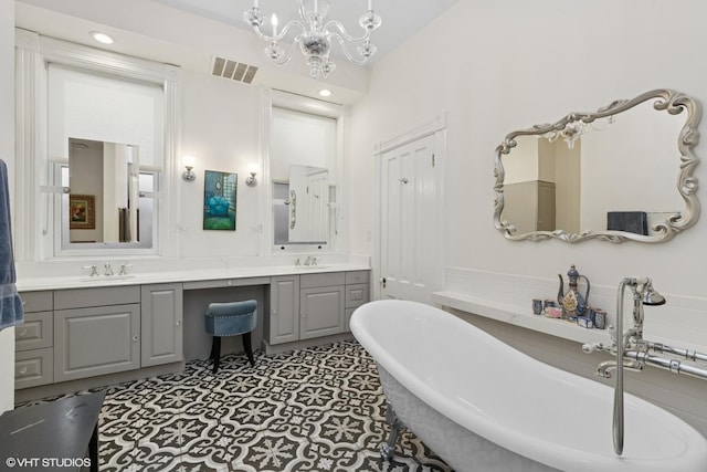 1957 W Schiller St, Chicago, IL 60622 - full bathroom featuring a freestanding bath, double vanity, and a chandelier