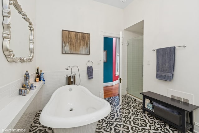 1957 W Schiller St, Chicago, IL 60622 - bathroom with a freestanding bath, a stall shower, and tile patterned flooring