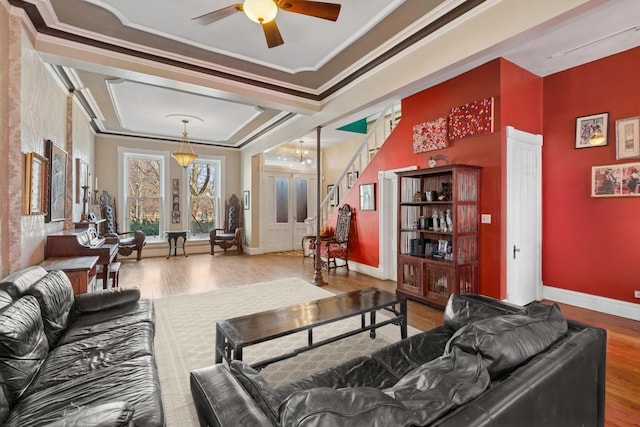 1957 W Schiller St, Chicago, IL 60622 - living room with wood finished floors, ceiling fan, ornamental molding, and stairs