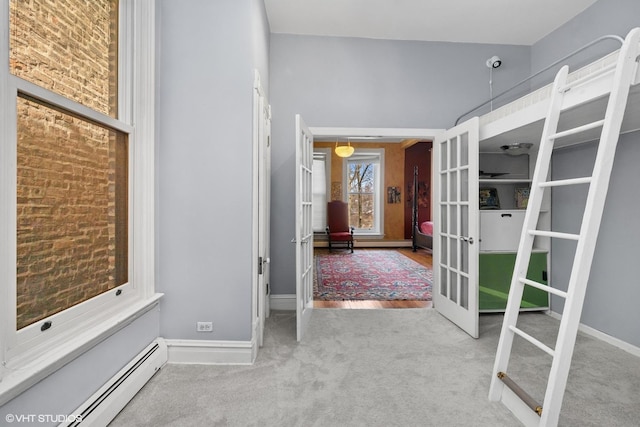 1957 W Schiller St, Chicago, IL 60622 - corridor featuring french doors, a baseboard heating unit, and carpet