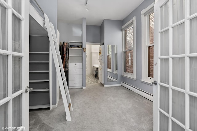 1957 W Schiller St, Chicago, IL 60622 - spacious closet featuring a baseboard heating unit, carpet floors, and french doors