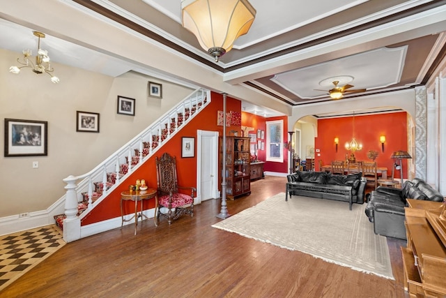1957 W Schiller St, Chicago, IL 60622 - living room with a chandelier, arched walkways, wood finished floors, stairway, and ceiling fan