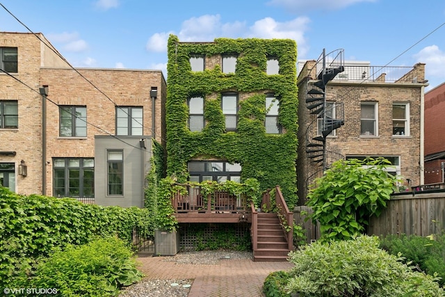 1957 W Schiller St, Chicago, IL 60622 - view of front facade featuring stairway and a deck