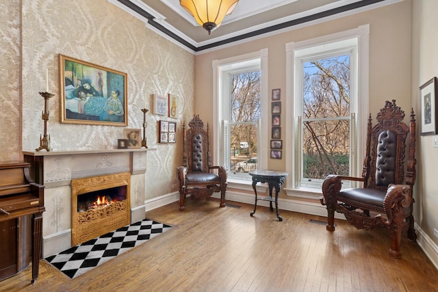 1957 W Schiller St, Chicago, IL 60622 - living area featuring wallpapered walls, wood-type flooring, a fireplace, and crown molding