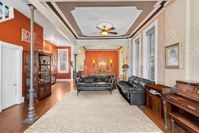 1957 W Schiller St, Chicago, IL 60622 - living room featuring wood finished floors, a ceiling fan, arched walkways, ornamental molding, and a chandelier