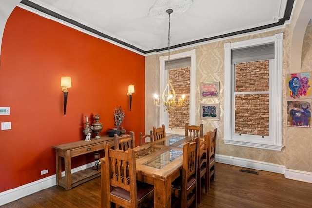 1957 W Schiller St, Chicago, IL 60622 - dining area featuring crown molding, wood finished floors, a chandelier, and wallpapered walls