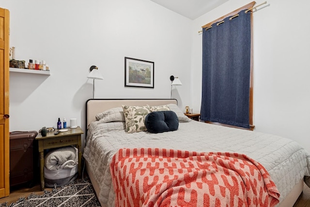 bedroom with wood finished floors