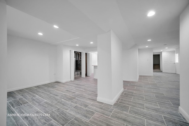 finished basement with recessed lighting, baseboards, and wood finish floors