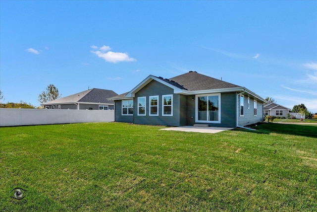 5656 Lantern Ln, Bourbonnais, IL 60914 - rear view of property featuring a lawn, roof with shingles, a patio, and fence