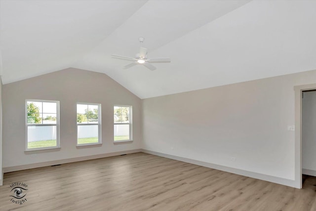 5656 Lantern Ln, Bourbonnais, IL 60914 - spare room with a wealth of natural light, light wood-style flooring, a ceiling fan, and vaulted ceiling