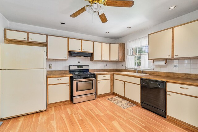 2201 W Acres Rd, Joliet, IL 60435 - kitchen featuring freestanding refrigerator, stainless steel gas range, black dishwasher, under cabinet range hood, and a sink