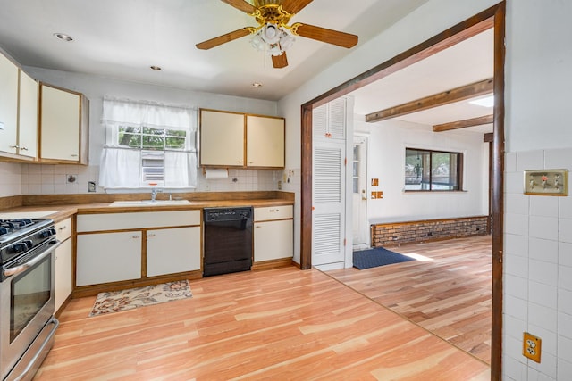 2201 W Acres Rd, Joliet, IL 60435 - kitchen featuring black dishwasher, stainless steel range with gas cooktop, light wood-style floors, a sink, and light countertops