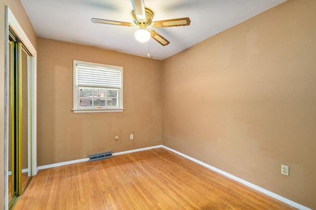 2201 W Acres Rd, Joliet, IL 60435 - unfurnished bedroom with baseboards, light wood-style floors, a closet, and a ceiling fan