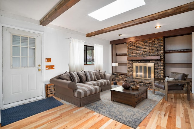 2201 W Acres Rd, Joliet, IL 60435 - living area featuring beam ceiling, wood finished floors, and a brick fireplace