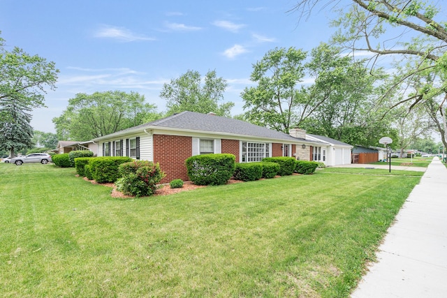 2201 W Acres Rd, Joliet, IL 60435 - ranch-style home featuring a front lawn, brick siding, driveway, an attached garage, and a chimney